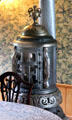 Dining room Stewart Oak cylindrical stove heater Alice Austen House Museum. Staten Island, NY.