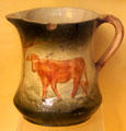 Ceramic pitcher painted with cow from Long Island at Old Bethpage Village. Old Bethpage, NY.