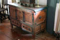 Connecticut-style chest with one drawer & carved sunflower in Schenck House parlor at Old Bethpage Village. Old Bethpage, NY.
