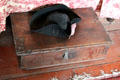 Tricorner hat & hatbox in Schenck House parlor at Old Bethpage Village. Old Bethpage, NY.