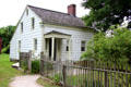 Conklin House with Greek revival porch at Old Bethpage Village. Old Bethpage, NY.