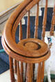 Carved spiral newel post at base of staircase at Sag Harbor Whaling Museum. Sag Harbor, NY.