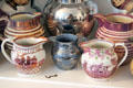 Array of lusterware pitchers in pink & blue at Home Sweet Home Museum. East Hampton, NY.