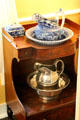 Blue & white & silver pitcher & basin washing sets at Home Sweet Home Museum. East Hampton, NY.