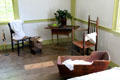 Cradle & sitting area with antique furnishings at Thomas Halsey Homestead. South Hampton, NY.