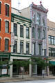 Green & white Holmes plus red & white Romanesque buildings at Fort Industry Square. Toledo, OH.