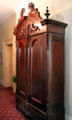 Cabinet with carved pediment at Kelton House Museum. Columbus, OH.