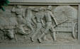 Oxen-drawn wagon relief on Wyoming Supreme Court & State Library Building. Cheyenne, WY.